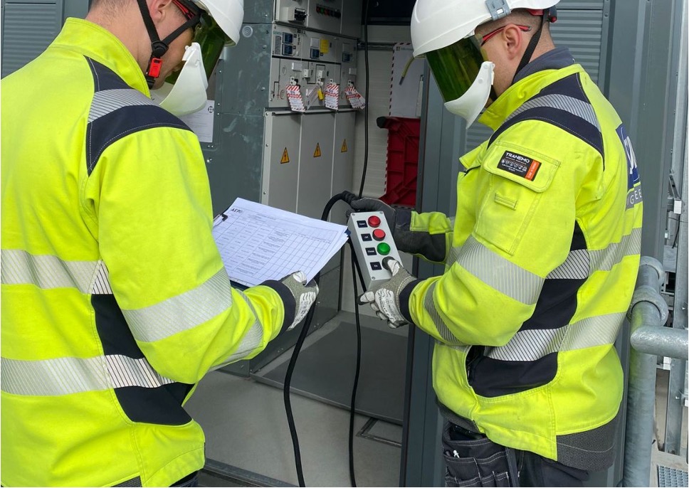 An image of two people performing a switching operation